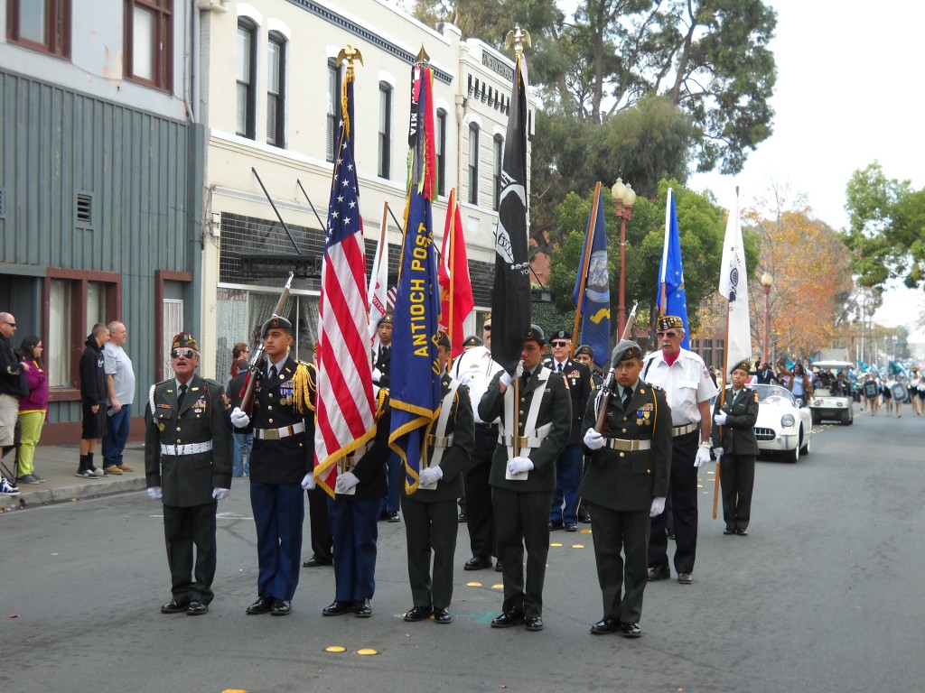 The color guard leads off the 2013 Antioch Veterans Day Parade on 2nd Street in historic Rivertown.