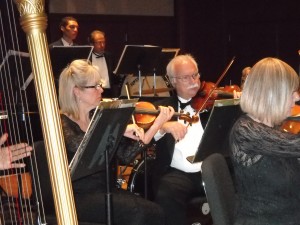 Antioch residents Jennifer Baston and Stuart Gillespie, play violin with the Contra Costa Chamber Orchestra at LMC, Saturday night.