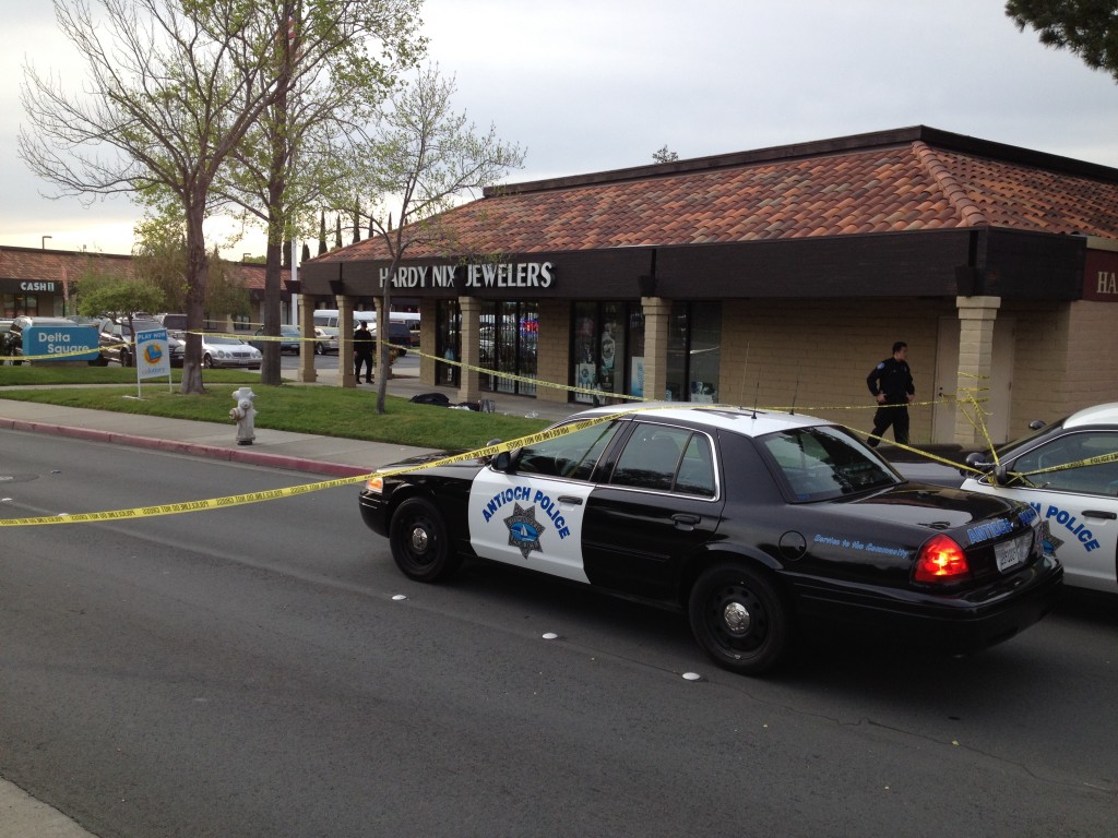 Police cordoned off the area around the Hardy Nix Jewelry store in Antioch after a robbery on Friday. One thief was shot and died in front of the store. By Allen Payton