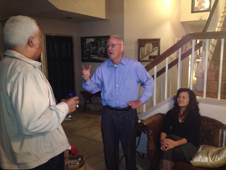 Walter Ruehlig talks with Bob Brooks, while Cynthia Ruehlig ponders the early election returns, at their home, Tuesday night.