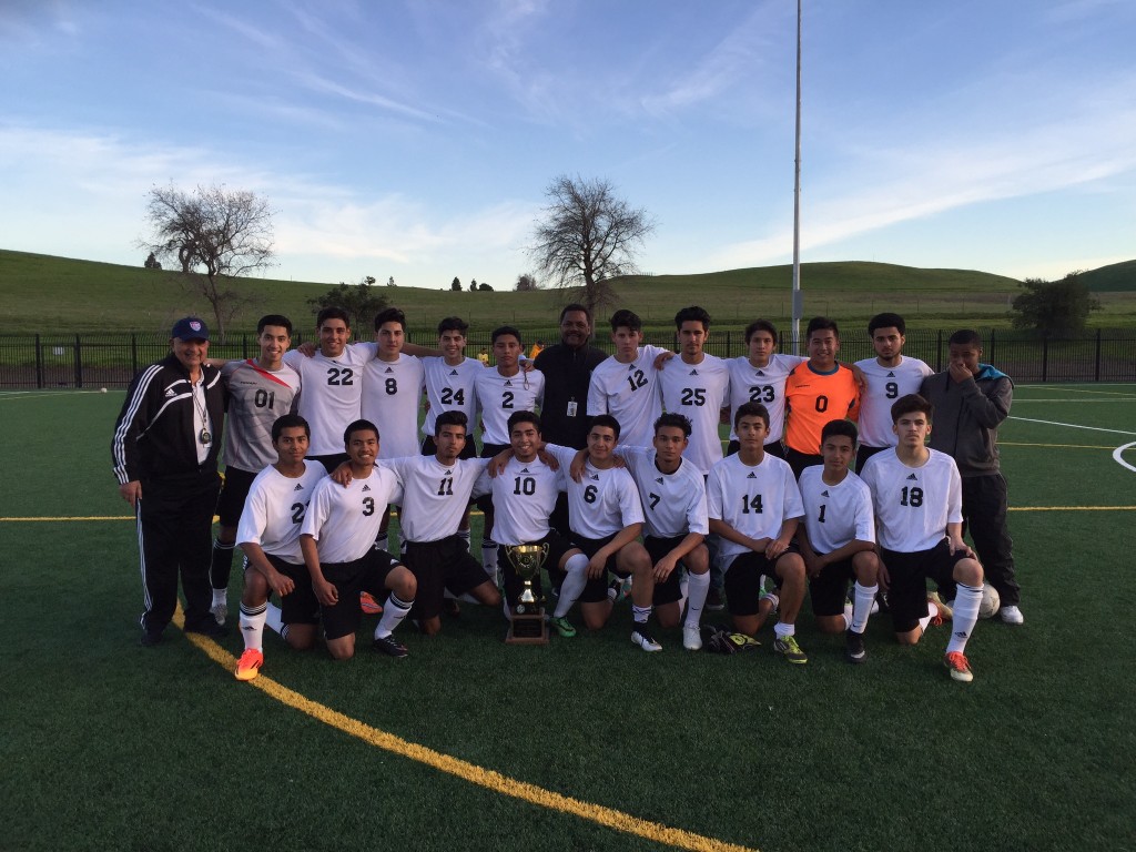 Antioch Mayor Wade Harper (center, back) with the Deer Valley High Boys Varsity Soccer team 2015 Mayor's Cup Champs. Head Coach Juan Tannus is on the left and the cup is in front of #10 Nathan Parada who scored the winning goal.
