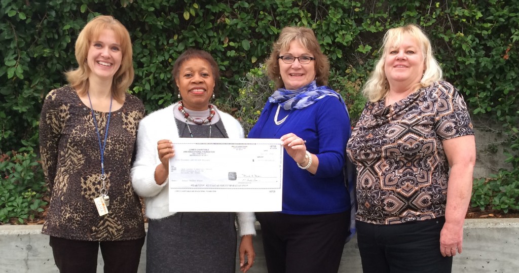 Cara Sawyer, Principal Dolores Williams, Vice Principal Laura Casdia (Vice Principal) and Charlene Vera, secretary at Jack London Elementary School in Antioch, show the check for $5,000 from Lowe's.