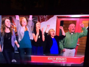 Ashley's friends, mom and dad watch her perform from the viewing room during the taping of The Voice.