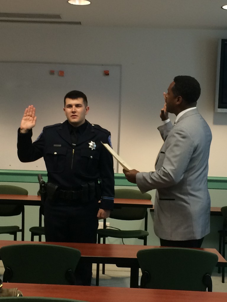 New Antioch police officer Aaron Hughes is sworn in by Mayor Wade Harper at a brief ceremony on Monday, April 13, 2015. Photo by Mayor Pro Tem Lori Ogorchock