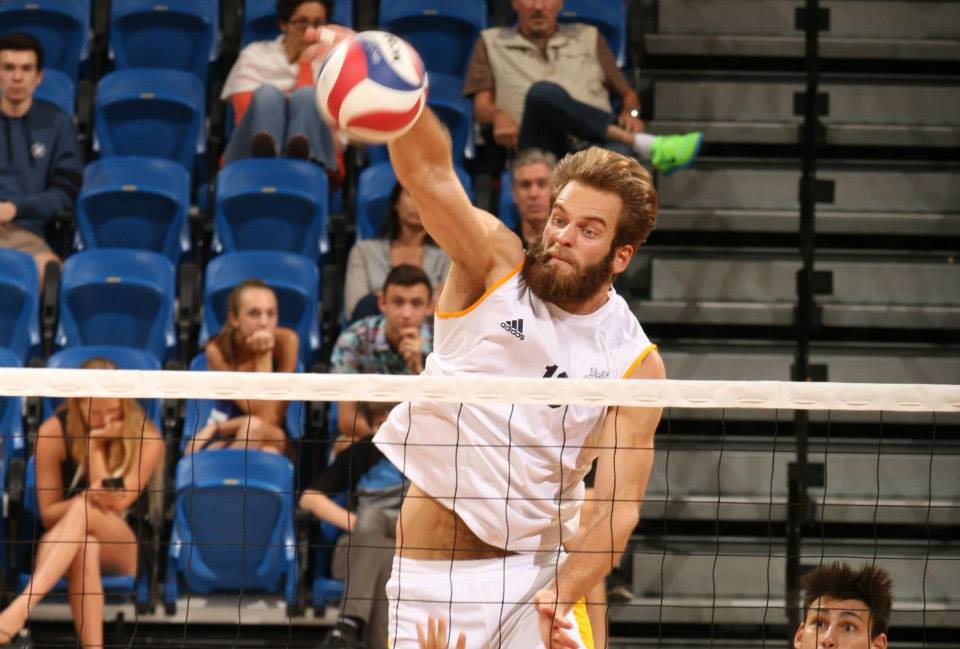 Jason Agopian spikes the volleyball during a match. courtesy of UCI Athletics.