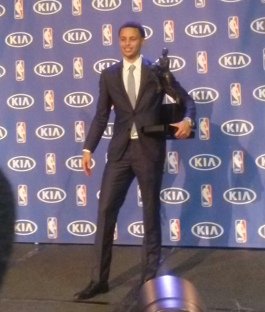 2014-2015 Kia NBA Most Valuable Player. Stephen Curry, holds his trophy during the MVP ceremony. He is the first MVP on the Warriors since Wilt Chamberlain in 1960. Photo by F.D. Purcell 