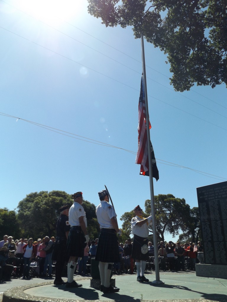 Military veterans of the color guard raise the U.S. and P.O.W. flags during the annual Antioch Memorial Day ceremony at Oak View Memorial Park, Monday, May 25, 2015
