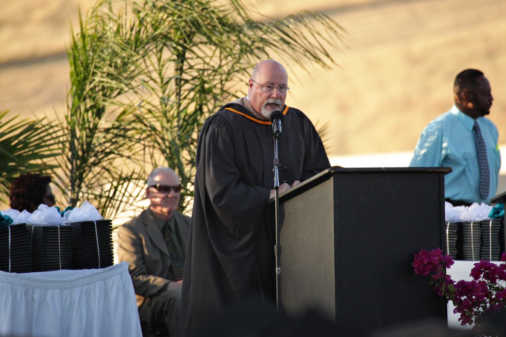 Deer Valley High Principal Ken Gardner speaks to the graduates. photo by Luke Johnson
