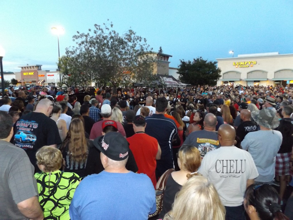 The crowd at the candelight vigil for Jeremy "Lumpy" Sturgill gathers in front of Lumpy's Diner in Antioch, and listens to his father Dave "Digger" Sturgill speak, Friday night, June 19, 2015.