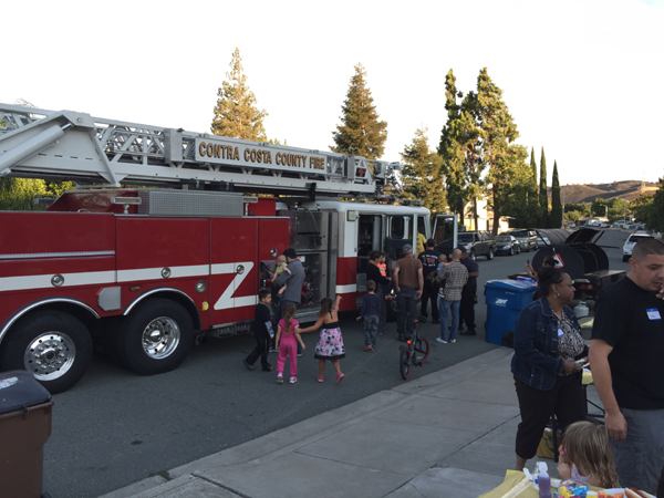 Residents enjoyed seeing and playing on a firetruck at the Tompkins Way neighborhood gathering for National Night Out on Tuesday, August 4, 2015.