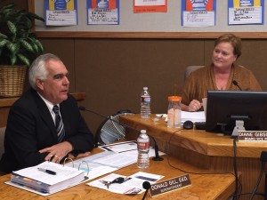 Dr. Don Gill speaks of his announced resignation while Antioch School Board Trustee Diane Gibson Gray listens, during Wednesday night's meeting.