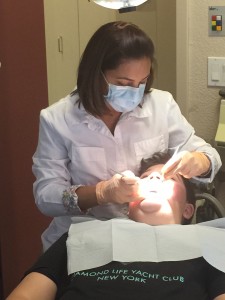 Dr. Sidhu treating one of her young patients.