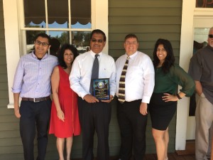 Chamber CEO Dr. Sean Wright (center right) Devon, Ursula, with Rodney (with plaque), and Nicole Lal.