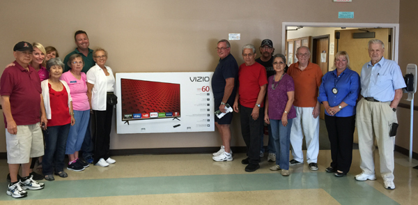 Members of the Antioch Rotary Club present a new, 60-inch TV to representatives of the Antioch Senior Center on Friday, Sept. 25.