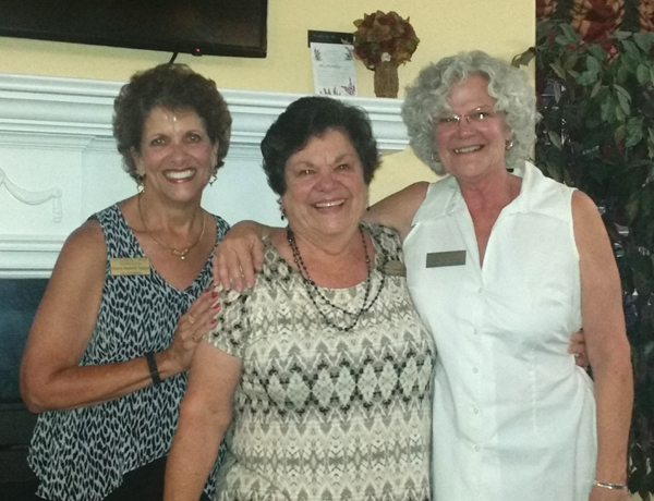 AEWF Board Chairwoman Sharon Pappas and Executive Director Mary Chapman with Board Member Julie St. Andrews, the mother of the $1,000 prize winner, Amanda Stockford, in the organization's "Fund A Wish" fundraiser.