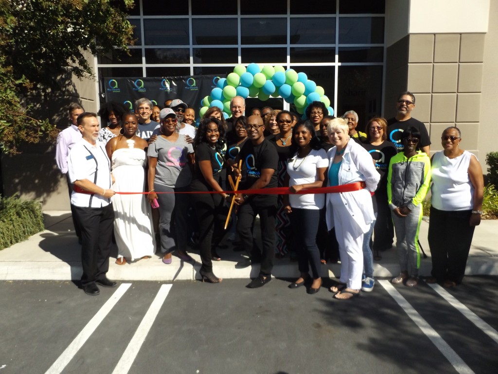 Representatives from Antioch Chamber of Commerce and City Council join Church@Antioch Pastor Chris Williams (with scissors), his wife Emery, and members of the A Team from their church to cut the ribbon at their new offices on Saturday, September 26, 2015.