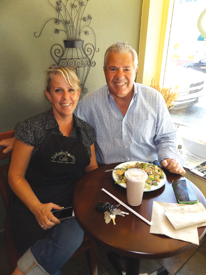 Owner Lynn Kutsal with one of her long time customers, Antioch businessman Isaac Negrin, as he enjoys a salad at Nature's Bounty, recently.
