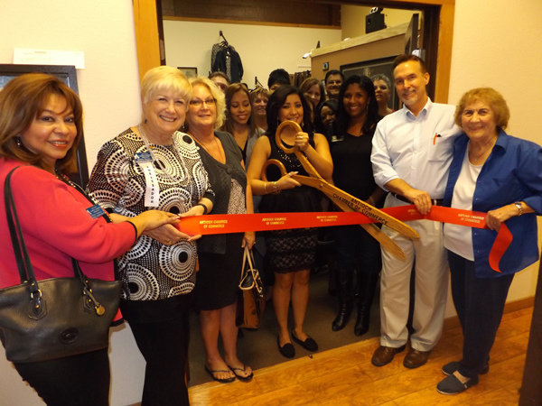 Zendy Garcia prepares to cut the ribbon to officially open her new store in Antioch's historic downtown Rivertown on Friday, October 23, 2015.