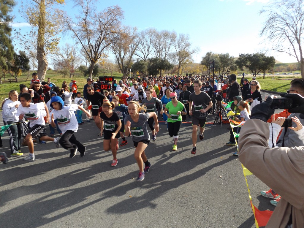 Runners begin the 10K race at the annual Holiday Run & Walk for Health at Contra Loma Regional Park in Antioch on Saturday, December 12, 2015.