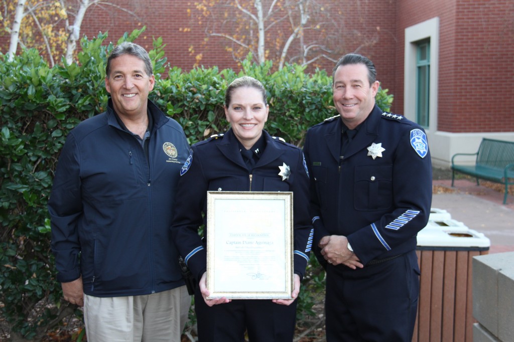 Captain Diane Aguinaga, with Chief Allan Cantandon, right, holds a certificate of recognition from Assemblyman Jim Frazier, left for her promotion, Tuesday, December 15, 2015. photo by Detective Ron Krenz.