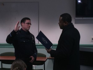 New Officer Kelly Inabnett is given his oath of office by Antioch Mayor Wade Harper.