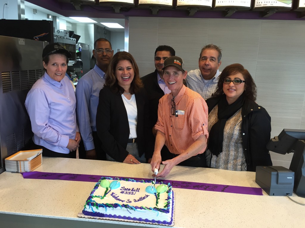 New Antioch Taco Bell Manager Carrie Landgraf and the Golden Gate Bell, LLC team cut the cake during the official opening celebration, Wednesday morning, December 9, 2015.