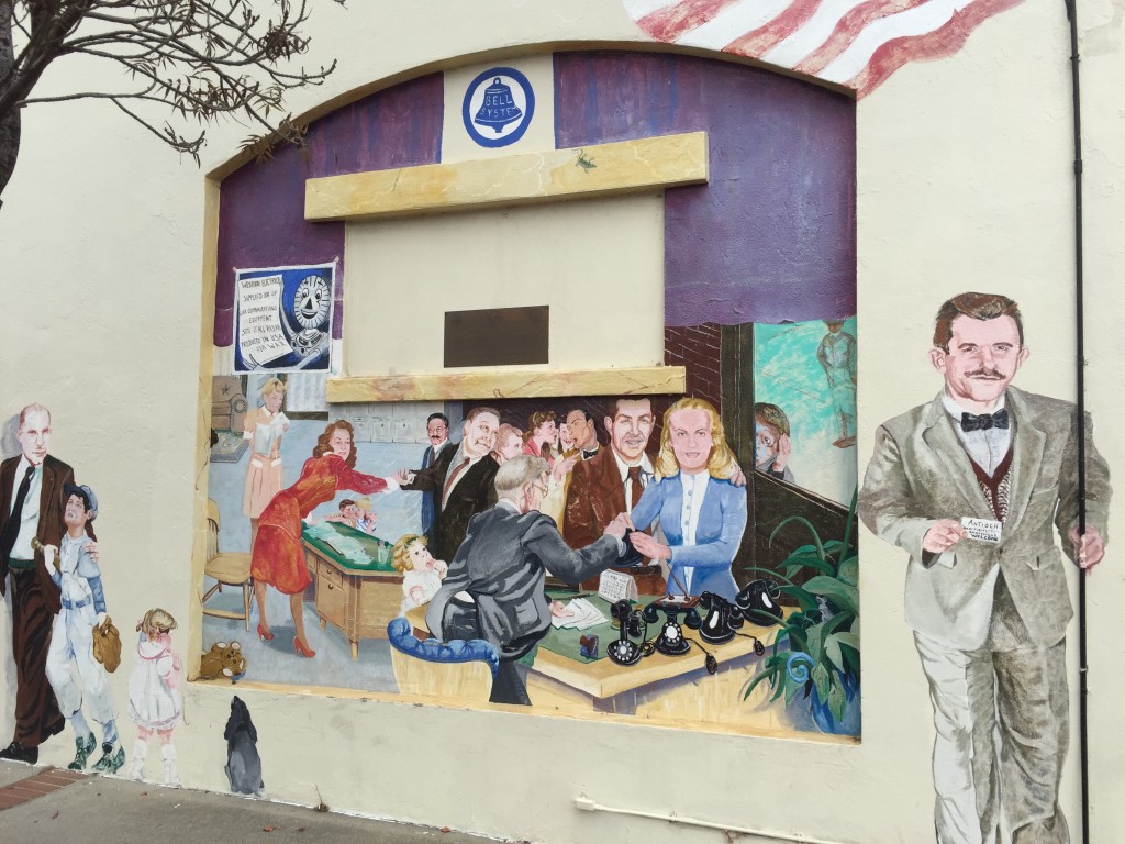 Mural of the old Antioch telephone office, depicting Don (in brown suit) and Helen (in blue and white) Meagher picking up their first phone.