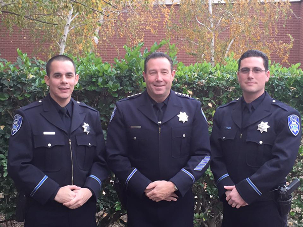 New Antioch Police Officers, Jason Erickson, left and Kelly Inabnett, right, with Chief Allan Cantando following their oath of office ceremony on Monday, November 30, 2015