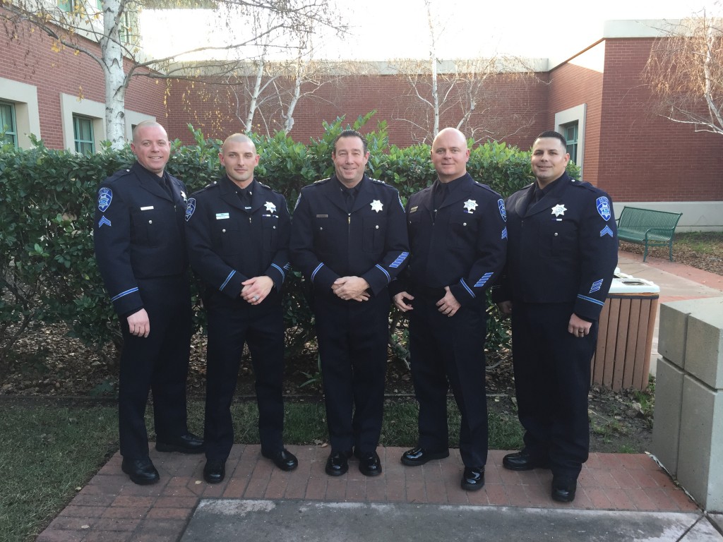 Chief Allan Cantando, center, is flanked from left to right by new Corporal Matt Koch, Lieutenant Desmond Bittner, Sergeant Jimmy Wisecarver and Corporal Mike Mortimer, following their promotion ceremony on Thursday, January 7, 2016.