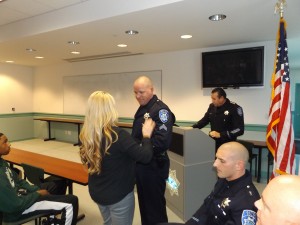 New Corporal Matt Koch is pinned by his wife.