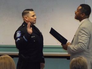New Corporal Mike Mortimer is given his oath of office by AMayor Wade Harper.