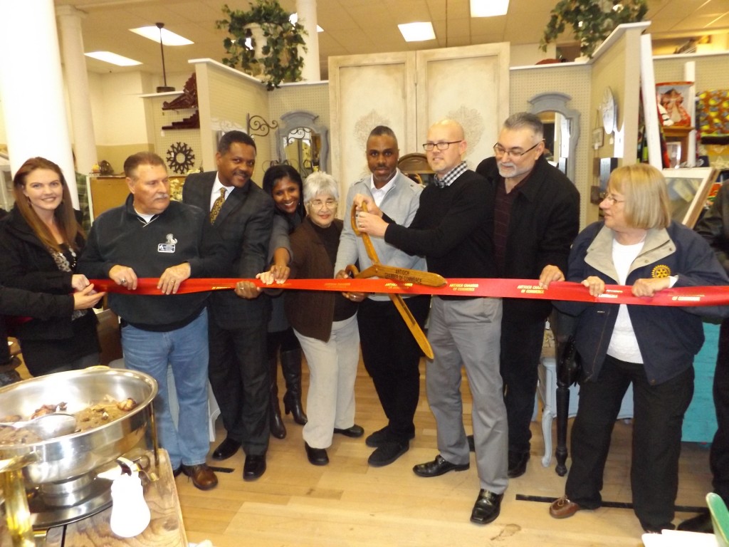 Antioch Chamber and City Council members join owners Brandon Woods and Michael Gabrielson (with scissors) for the ribbon cutting to officially open their new G St. Mercantile store in downtown, Friday evening, January 15th.