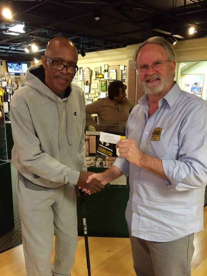 Antioch High School Basketball Coach Sam Johnson, who drew the winning ticket and whose daughters are in the Antioch Sports Legends, with Tom Lamothe, Executive Director.