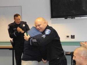 Sr. hugs his son, new Sgt. Jimmy Wisecarver, Jr. after pinning him.
