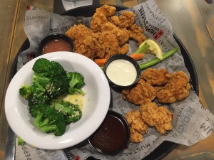 A sampling of their wings and flavors, with garlic parmesan broccoli.