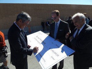 Iwasaki of the CCTA signs a ceremonial check for the leftover funds totaling $1 million, as Steve Heminger, Executive Director of the Metropolitan Transportation Commission and Bijan Sartipi, Region IV Director for CalTrans look on.