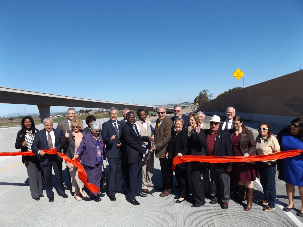 Officials celebrate after cutting the ribbon on the new Highway 4/160 northbound ramp on Monday, Feb. 29, 2016.