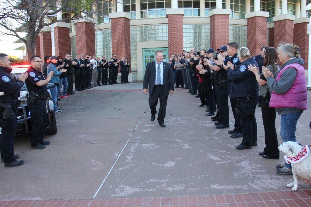 Retired Antioch Police Captain Leonard Orman walks out of the Antioch Police Facility on his final day, past fellow officers and staff. photo courtesy of APD
