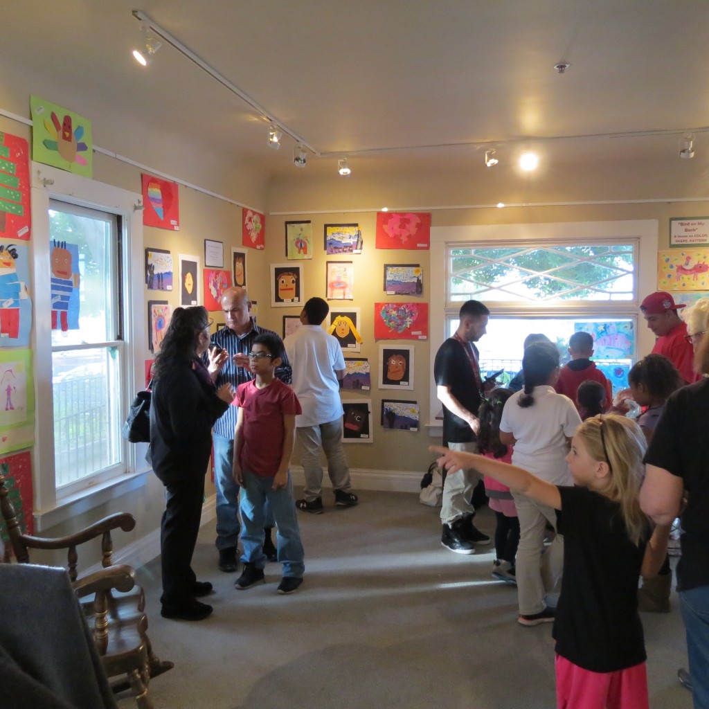 Students and residents attend the Sutter Elementary School Art Exhibit at the Lynn House Gallery in March.