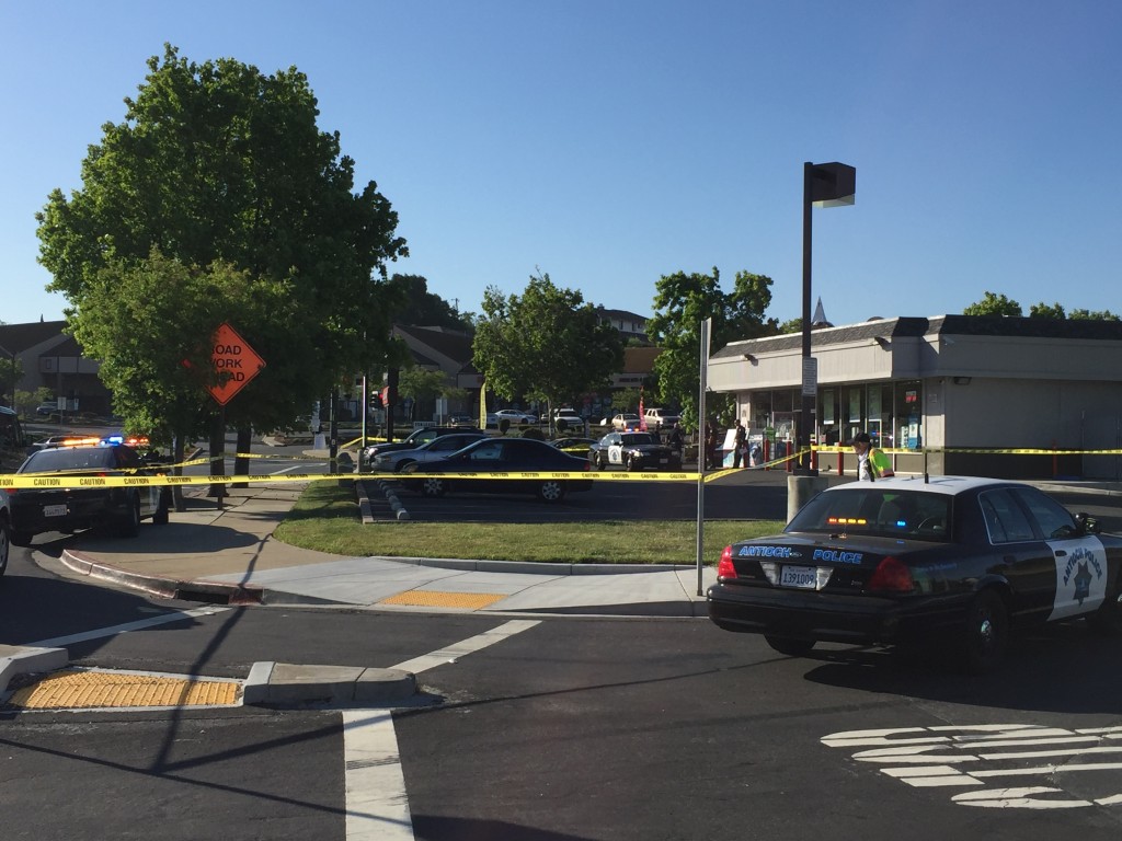 Antioch Police had the QuickStop convenience store and parking lot on W. Tregallas cordoned off, during the investigation of the shooting homicide, Monday morning, May 2, 2016.