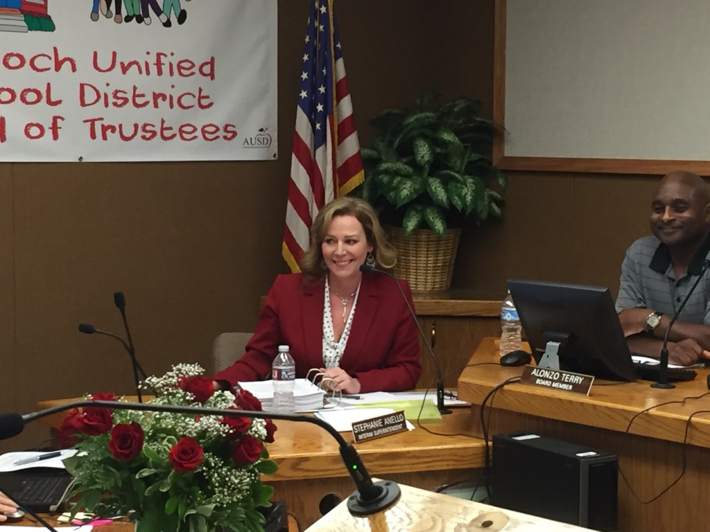 New Antioch schools Superintendent Stephanie Anello smiles to the applause of the audience following the vote to hire her by the Board, at their meeting, Wednesday night, June 22, 2016.