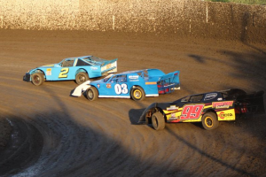 Limited Late Model All Time feature win leader Mike Gustafson #2 leads rookie Kimo Oreta #03 and Jim Freethy #99 in a heat race.  Photo by Ryan Brown.