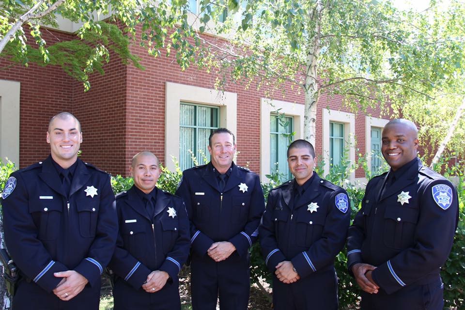 From left: Officers Matthew Davis, Wilson Delacruz, Salvador Montanez and Quamaine Murphy with Chief Allan Cantando, center.