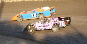 Limited Late Model point leader Larry Damitz #15 and Mark Garner #76 battle for a heat race win.  Photo By Ryan Brown.