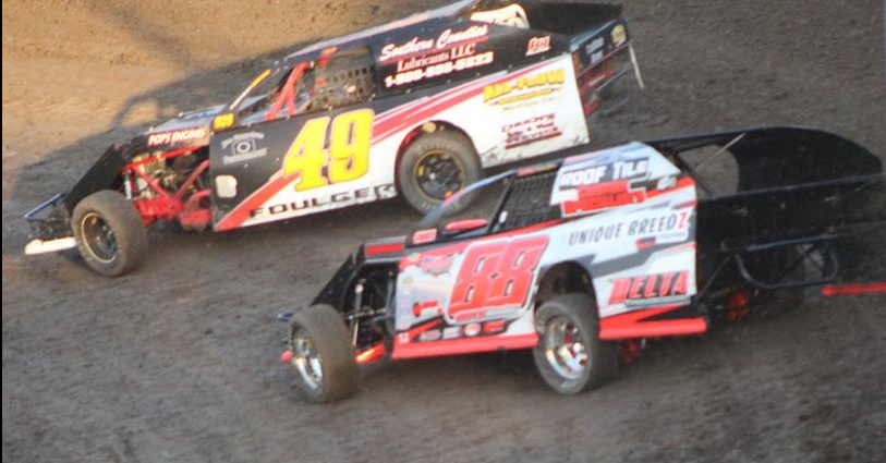 Four time A Modified champion Troy Foulger #49 and point leader leader Carl Berendsen II #88 battle for position.  Photo By Ryan Brown.