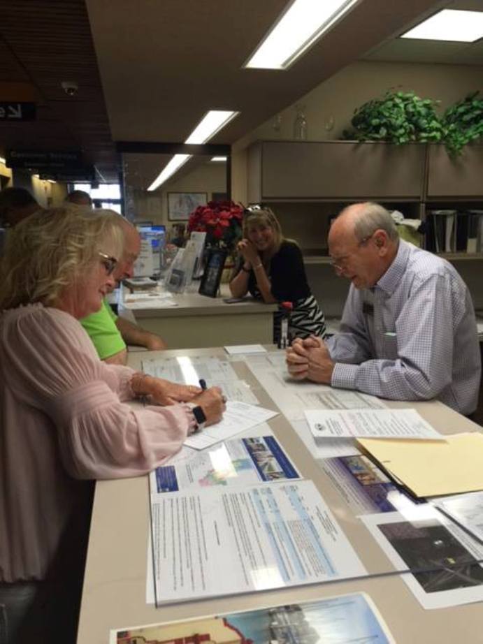 Antioch Mayor Pro Tem Lori Ogorchock files her papers with City Clerk Arne Simonsen as Campaign Treasurer Bill Chapman and friend Kristen Vistalli look on.