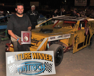 Nick DeCarlo borrowed the Lloyd Cline #11 car and drove it to victory in the B Modified Main Event.  In the background is second place finisher Trevor Clymens #2c.  Photo By Paul Gould