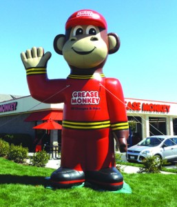 The big Grease Monkey balloon will greet you at the corner of Auto Center Drive and West 18th Street.