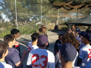 Dusty Baker speaks with the Game Changers Little League baseball team.