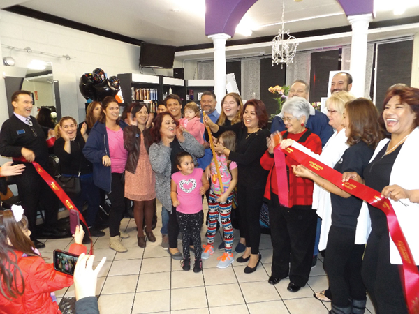 Owner Gricelda Gomez  (with scissors) celebrates the one year anniversary of her salon located at 714 W. 10th St. with Antioch’s city and business leaders, and massage therapist Victoria Green (far right) on Tuesday, Nov. 22.
